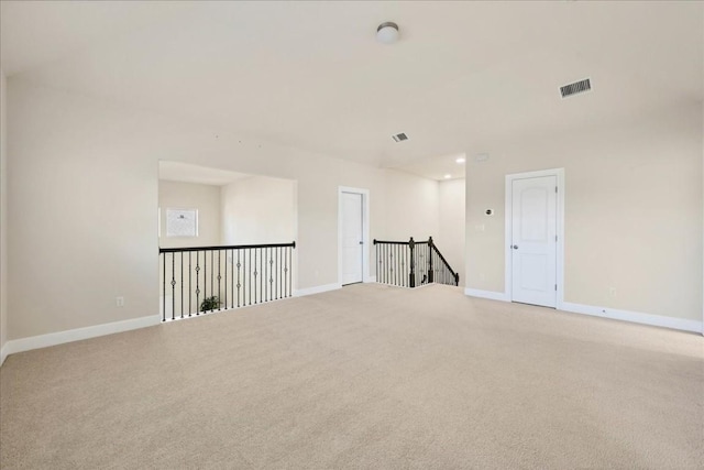 empty room with light colored carpet