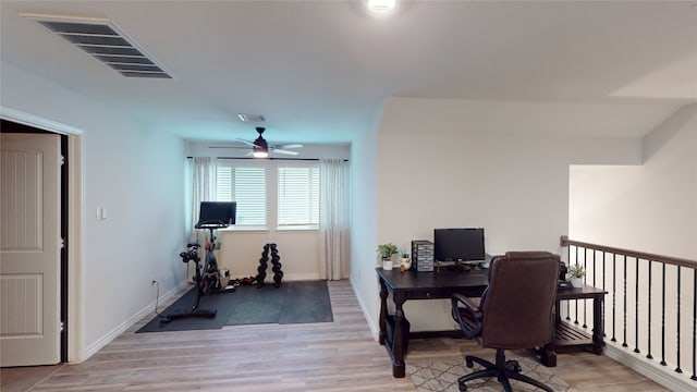 office with ceiling fan and light hardwood / wood-style floors