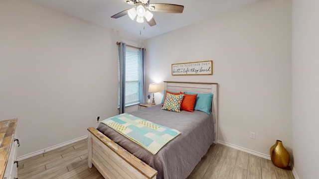 bedroom with light hardwood / wood-style flooring and ceiling fan