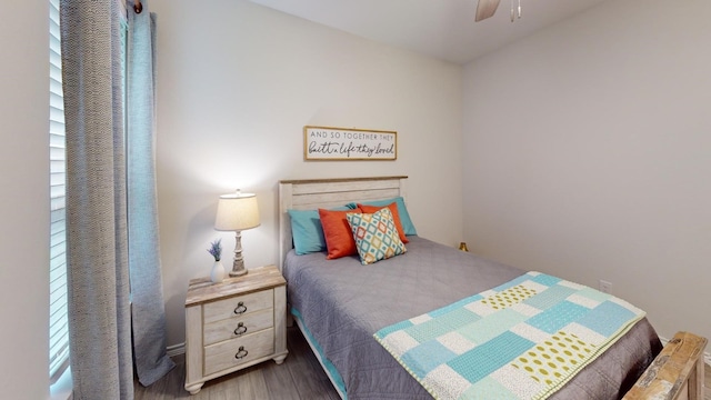 bedroom with hardwood / wood-style floors and ceiling fan