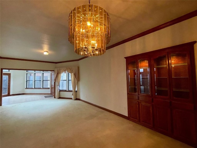 carpeted empty room with crown molding and a notable chandelier