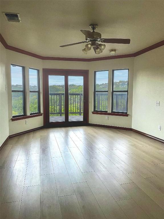 4324 Far W Blvd, Austin, TX 78731 - empty room with ornamental molding, ceiling fan, and hardwood / wood-style floors