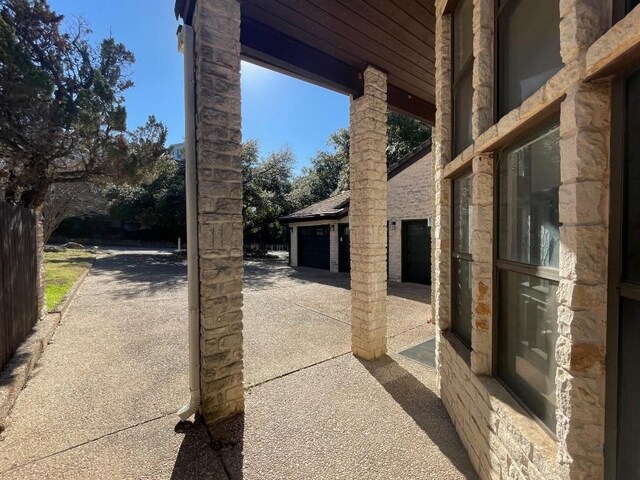 4324 Far W Blvd, Austin, TX 78731 - view of patio featuring a garage and concrete driveway