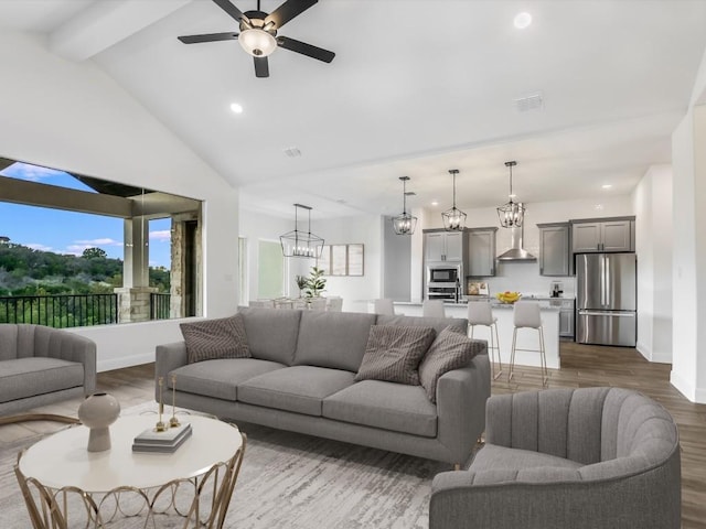 living room featuring ceiling fan, beam ceiling, dark wood-type flooring, and high vaulted ceiling