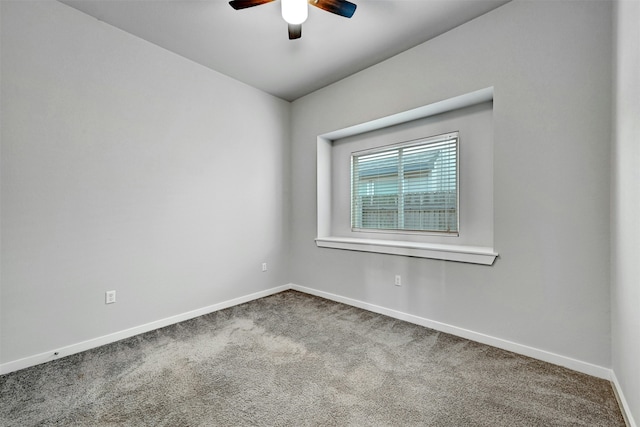 unfurnished room with ceiling fan and carpet flooring