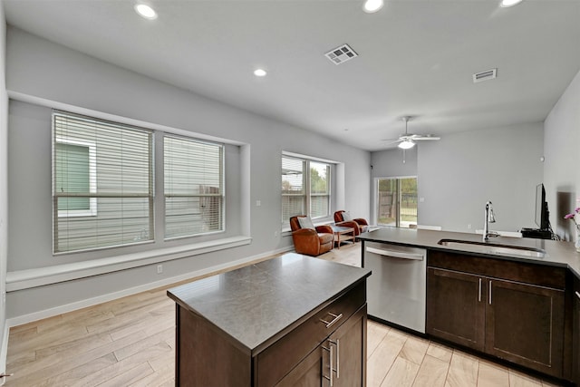 kitchen with sink, a center island, light wood-type flooring, dishwasher, and ceiling fan