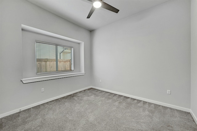 unfurnished room featuring ceiling fan and carpet floors