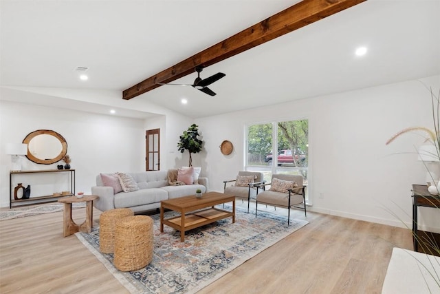 living room with vaulted ceiling with beams, ceiling fan, and light hardwood / wood-style flooring