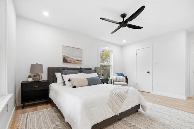 bedroom with wood-type flooring and ceiling fan