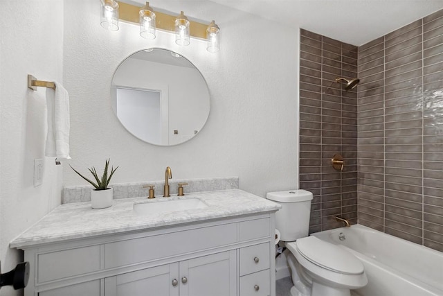 full bathroom featuring vanity, toilet, and tiled shower / bath combo