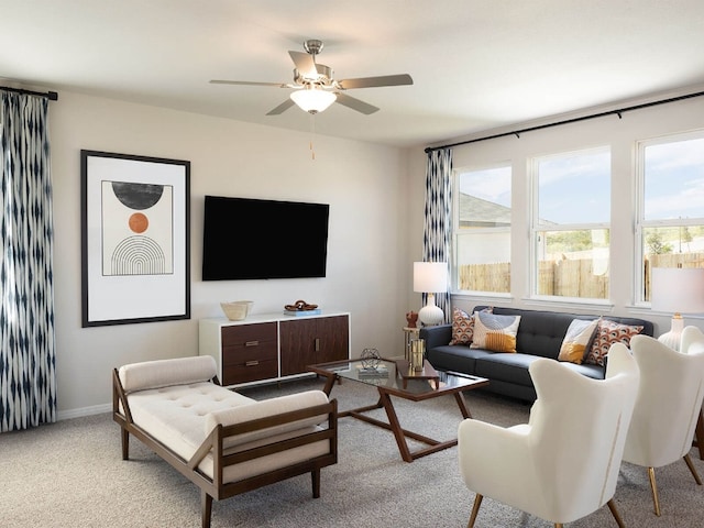 living room featuring ceiling fan and light colored carpet