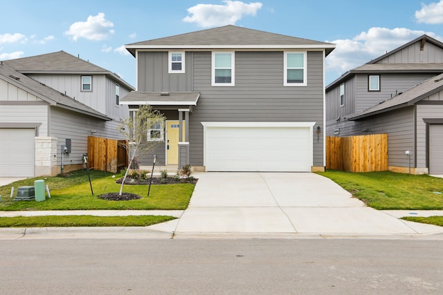 view of front facade with a front yard and a garage