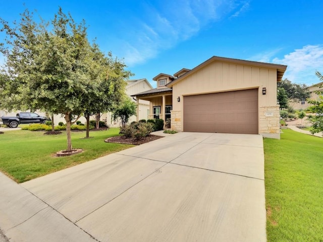 view of front facade featuring a garage and a front lawn