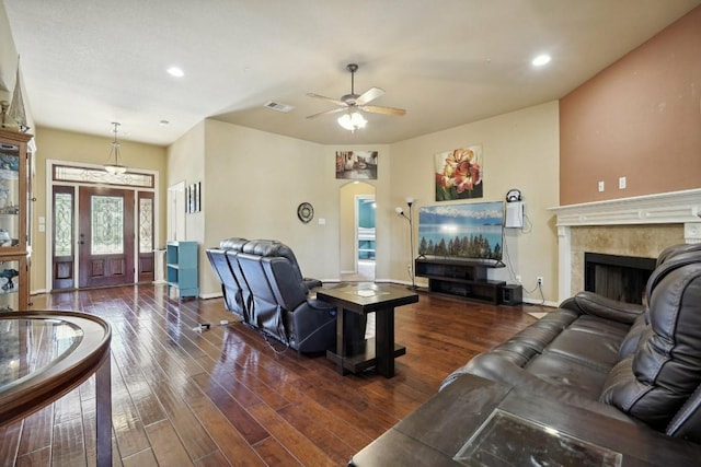 living room with ceiling fan and dark hardwood / wood-style flooring