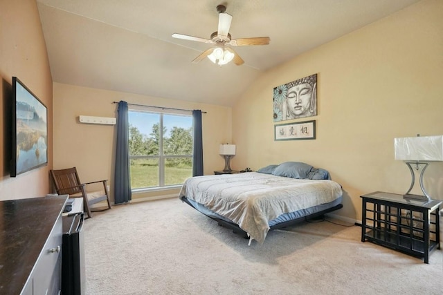 bedroom with ceiling fan, light carpet, and lofted ceiling