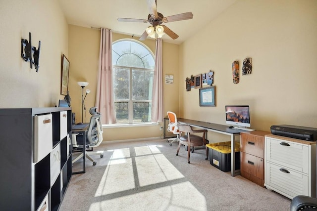 carpeted home office with ceiling fan and lofted ceiling