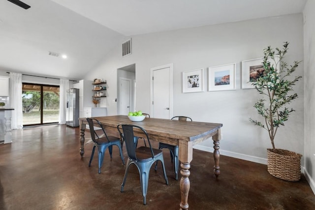 dining room with vaulted ceiling