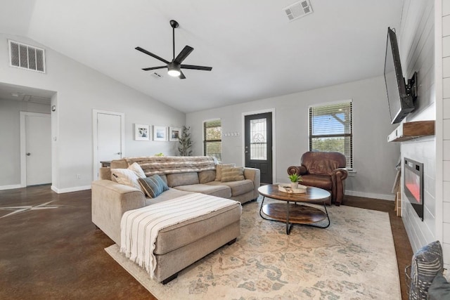 living room featuring a large fireplace, ceiling fan, and lofted ceiling