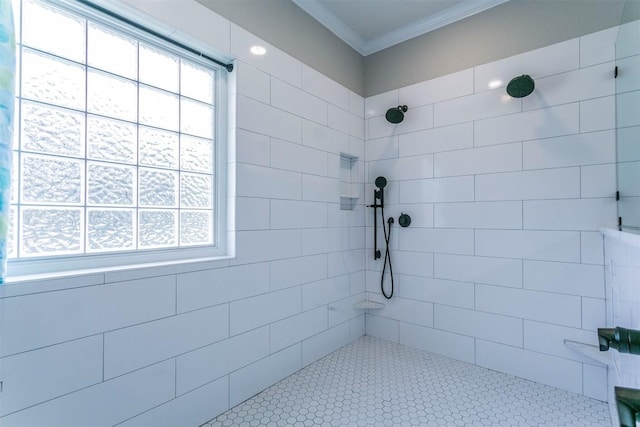 bathroom featuring tiled shower and ornamental molding