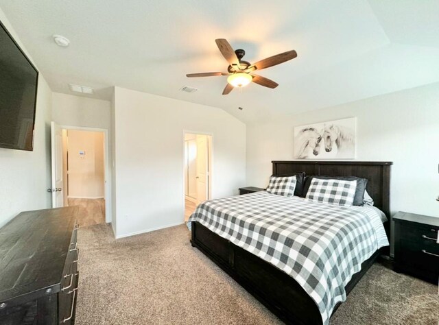 carpeted bedroom with vaulted ceiling and ceiling fan