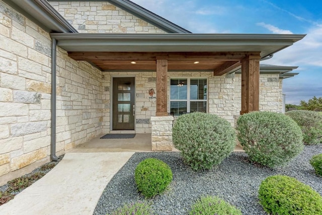 property entrance featuring a porch