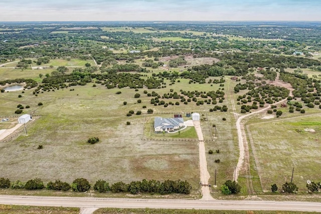 birds eye view of property featuring a rural view