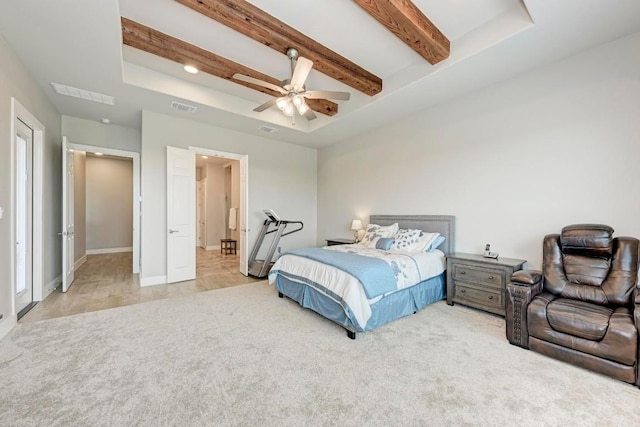 carpeted bedroom with beamed ceiling and ceiling fan