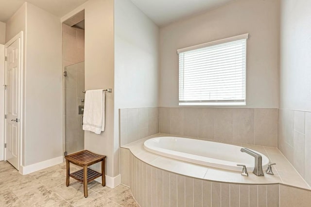 bathroom with tile patterned floors and plus walk in shower