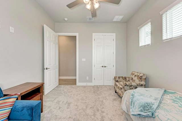 sitting room featuring light carpet and ceiling fan