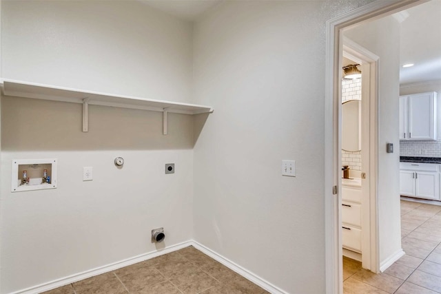 laundry room with hookup for a washing machine, hookup for a gas dryer, electric dryer hookup, and light tile patterned flooring