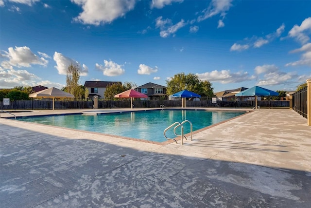 view of swimming pool featuring a patio area