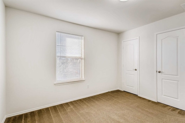 unfurnished bedroom featuring carpet