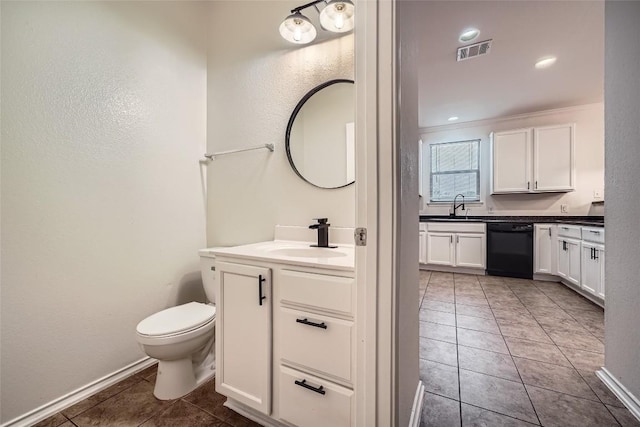 bathroom featuring tile patterned flooring, vanity, and toilet