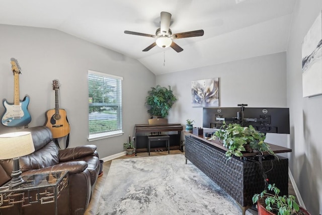 office space featuring ceiling fan, lofted ceiling, and hardwood / wood-style flooring