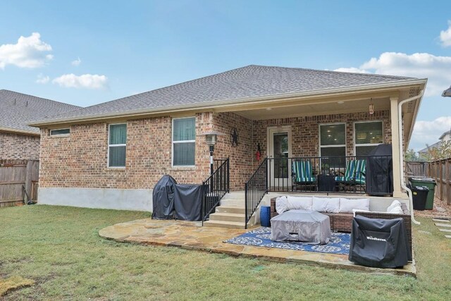 2912 Youngwood St, Leander, TX 78641 - rear view of house with a fenced backyard, brick siding, a shingled roof, and a patio