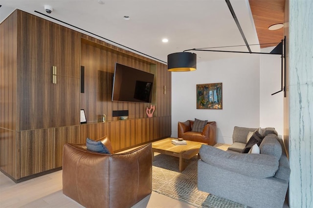 living room with wood walls