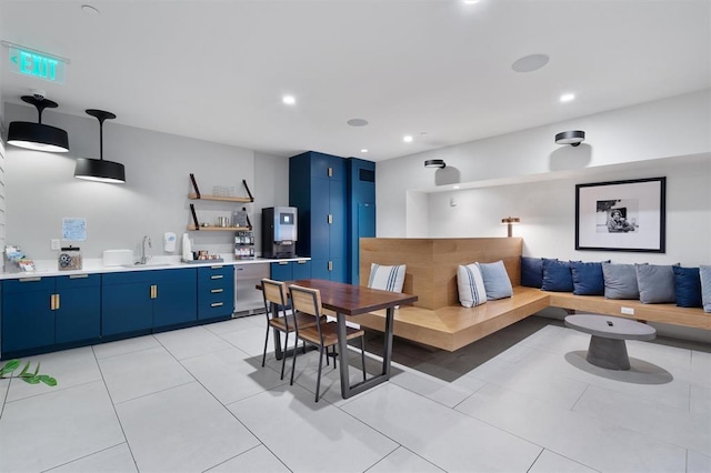 tiled dining room with sink