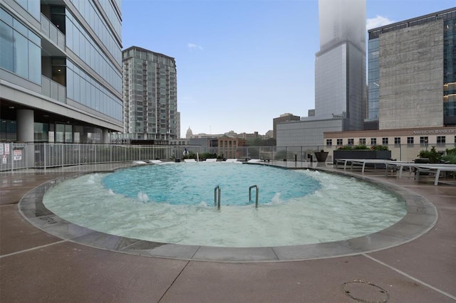 view of swimming pool with a patio area