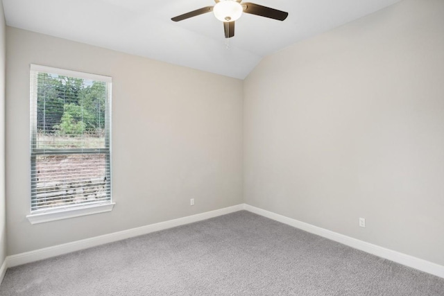 empty room with carpet flooring, ceiling fan, and lofted ceiling