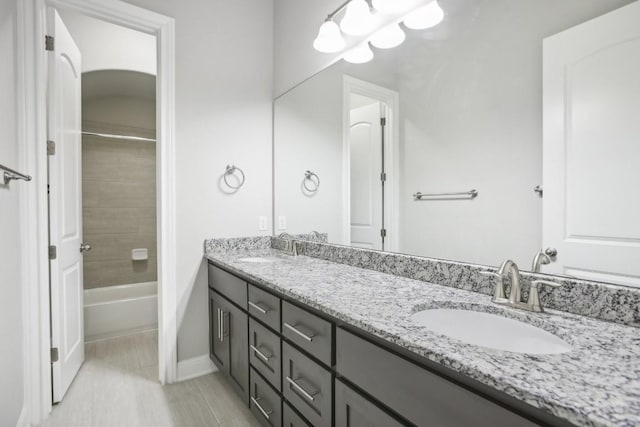 bathroom with vanity and shower / bath combination