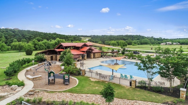 view of pool with a playground