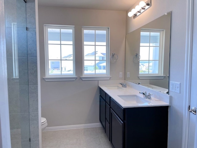 bathroom featuring tile patterned floors, vanity, and toilet