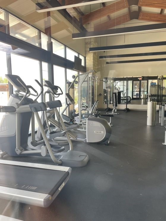 workout area with high vaulted ceiling