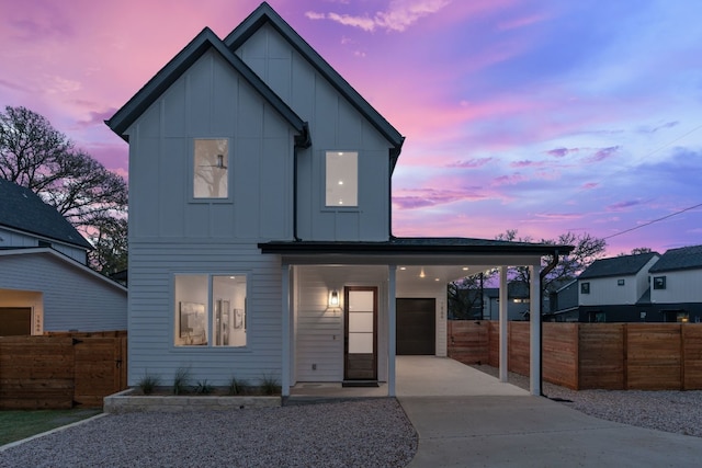 view of front of home featuring a carport and a garage