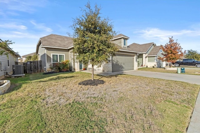 view of front of house featuring a front yard, central AC, and a garage