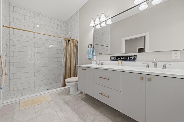 bathroom featuring a shower with curtain, vanity, and toilet