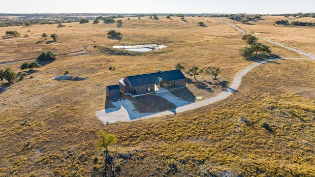 birds eye view of property featuring a rural view