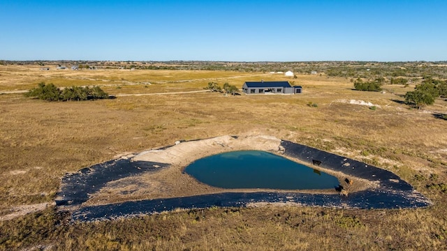 aerial view featuring a water view and a rural view