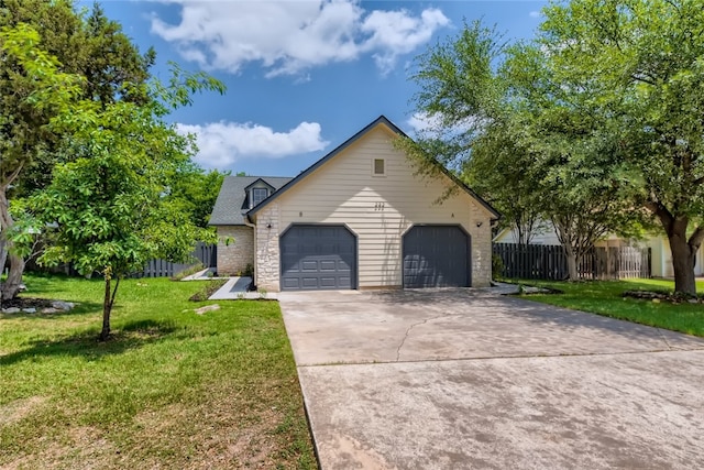 view of front facade with a garage and a front yard