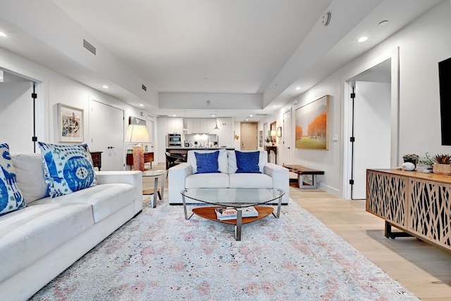 70 Rainey St Unit 1306, Austin, TX 78701 - living area with light wood-type flooring and recessed lighting